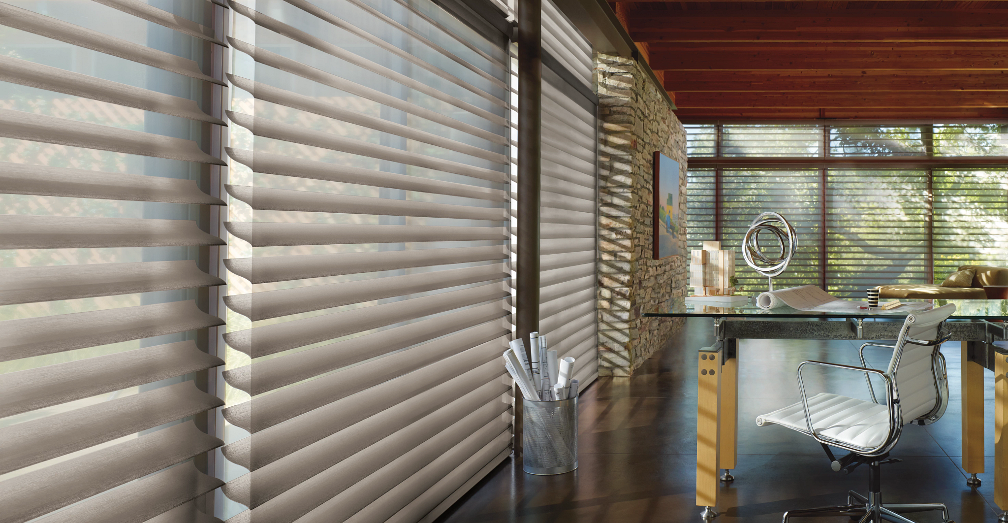 Commercial window shades in a modern Pittsburgh office with custom solar roller shades for glare and light control
