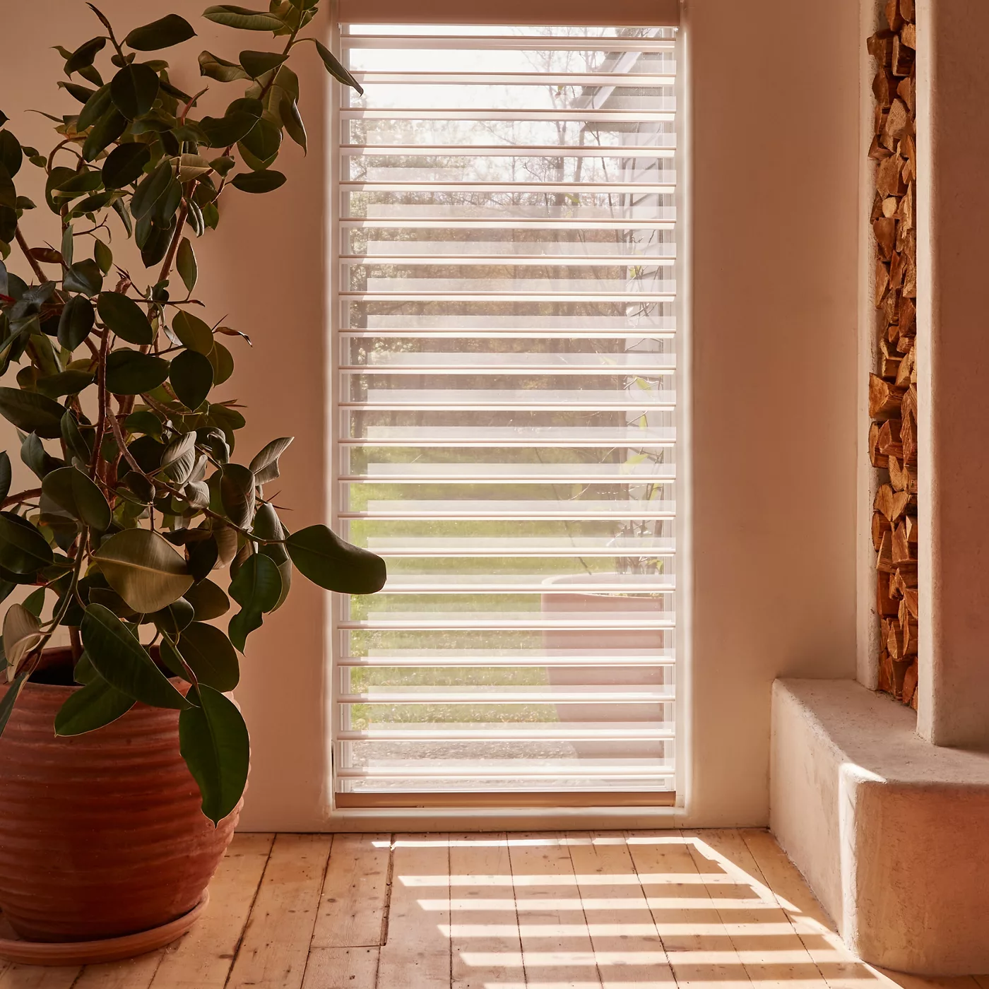 End of hallway featuring a window with shades